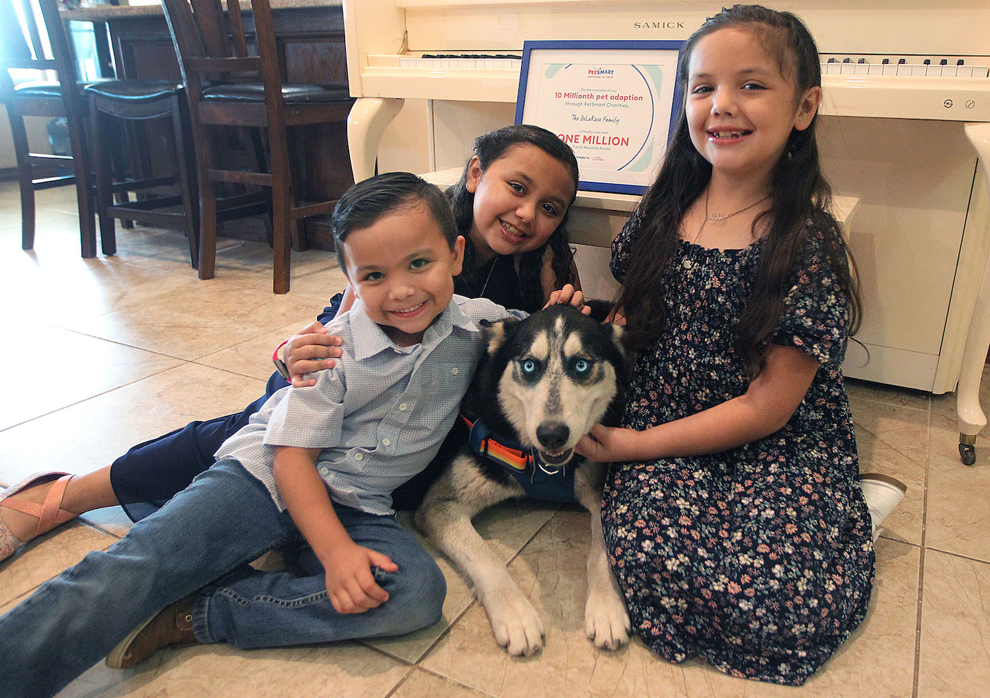 The De La Rosa family and their dog Balto