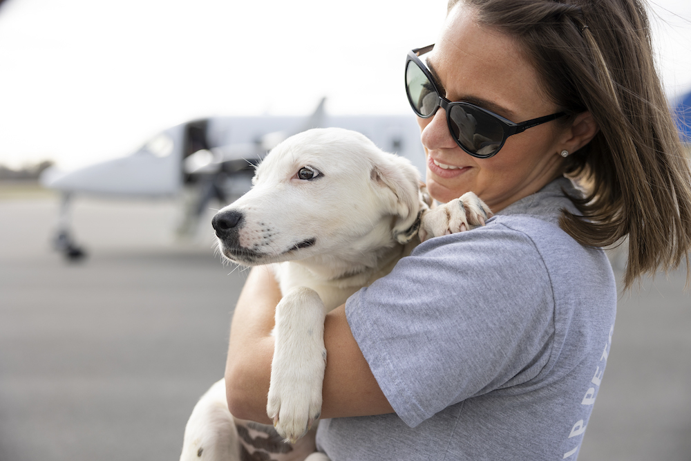 Heidi Marston and a white dog