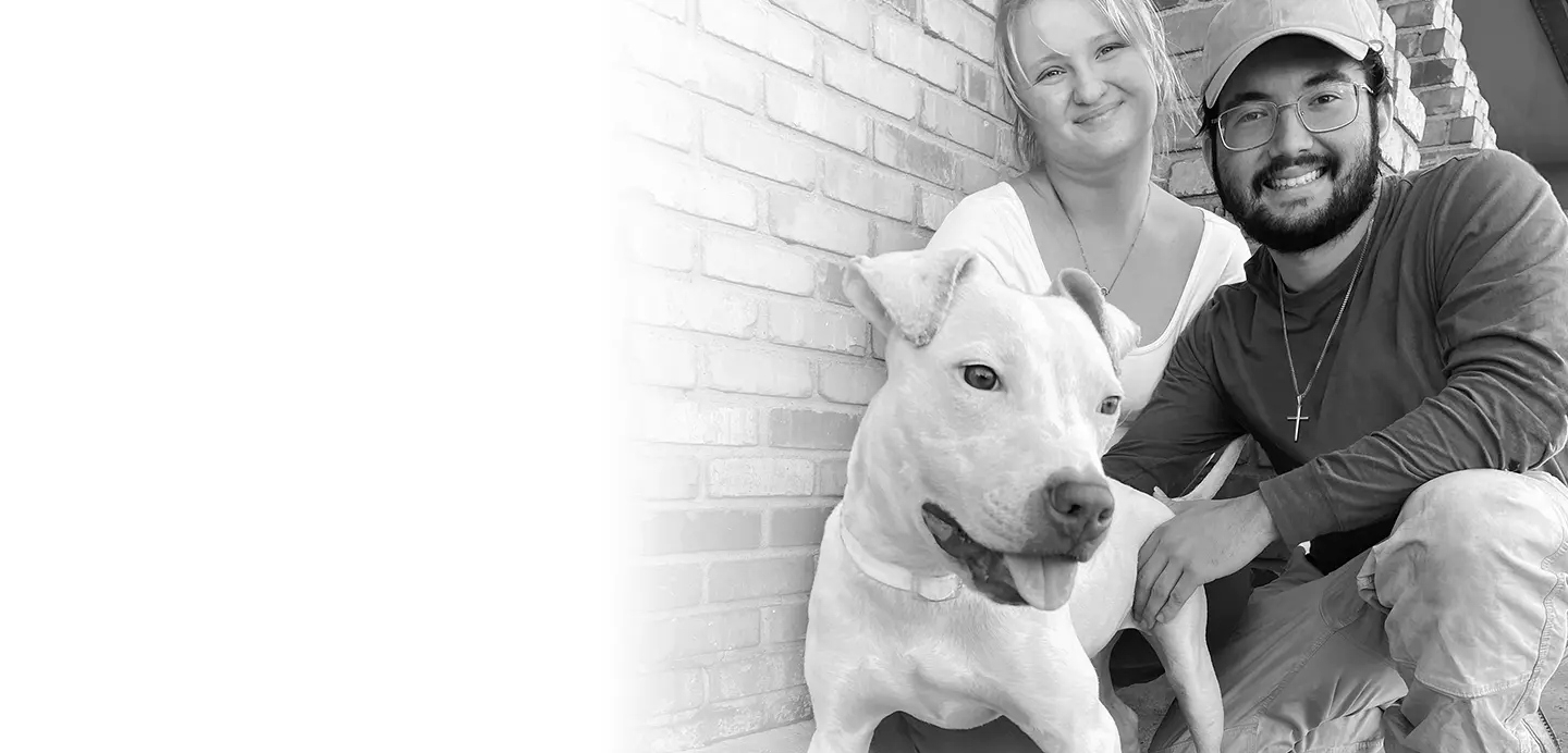 Couple with large white dog